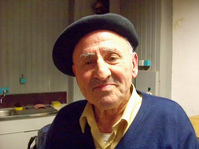 Potrait von Lucio, Er trägt eine Baskenmütze und lächelt in die Kamera